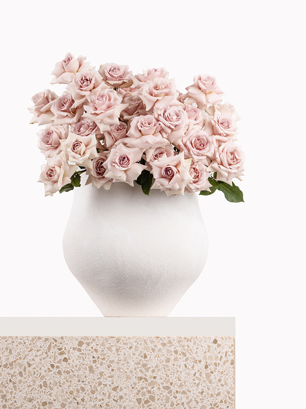 Beige roses in White Fibre glass vase